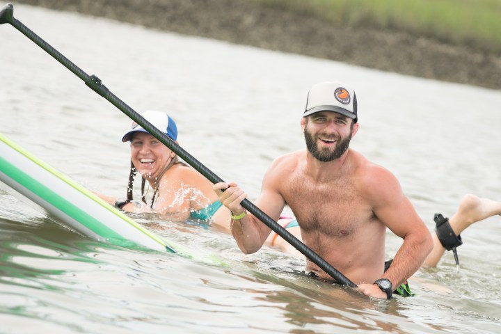man and woman on in the water
