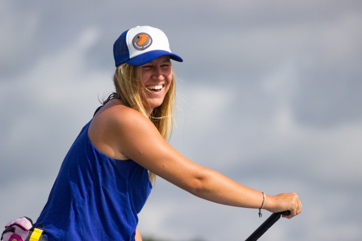 girl smiling on paddle board