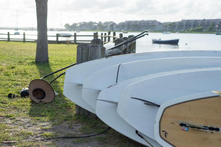 paddle boards on their side