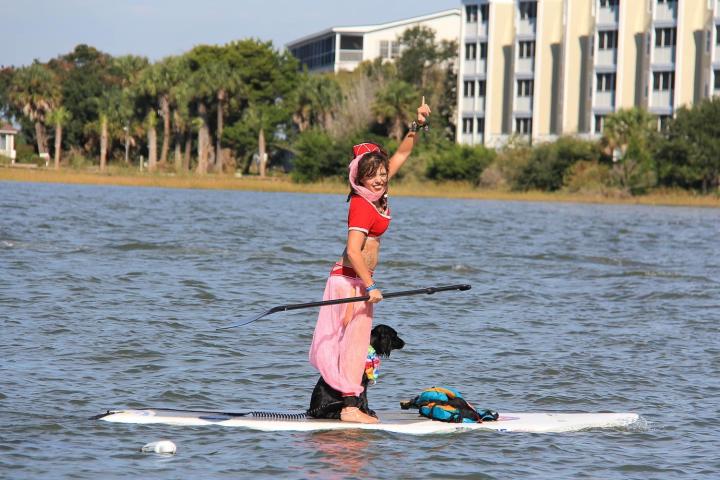 woman in costume on paddle board